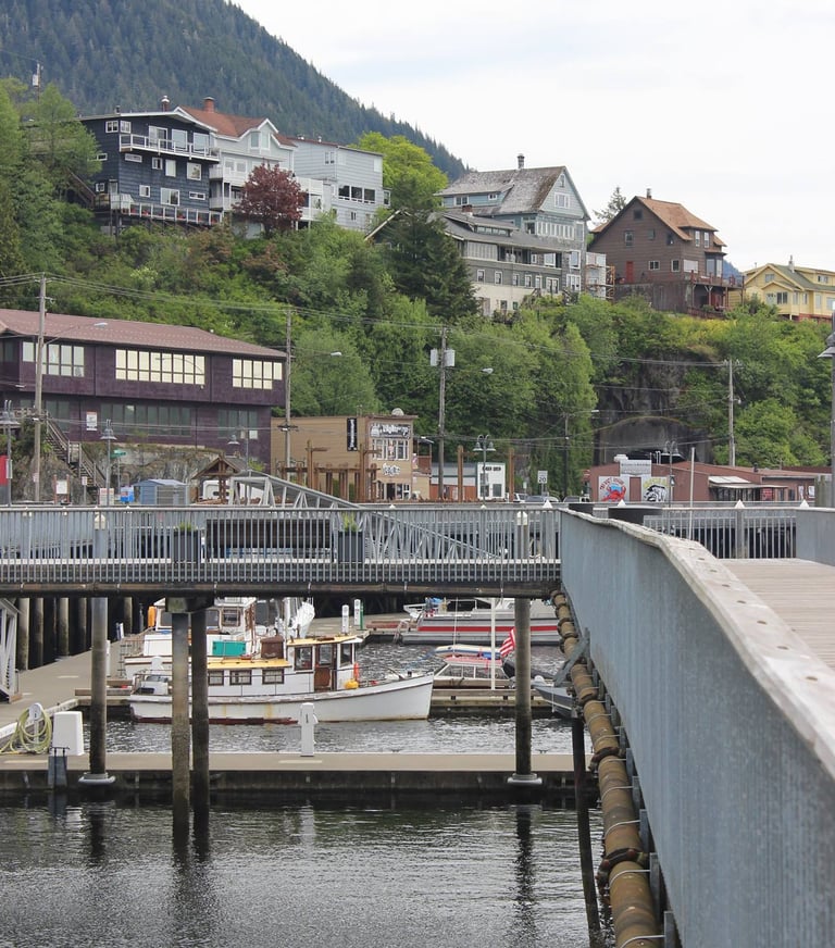 a bridge over a river with a boat in the water