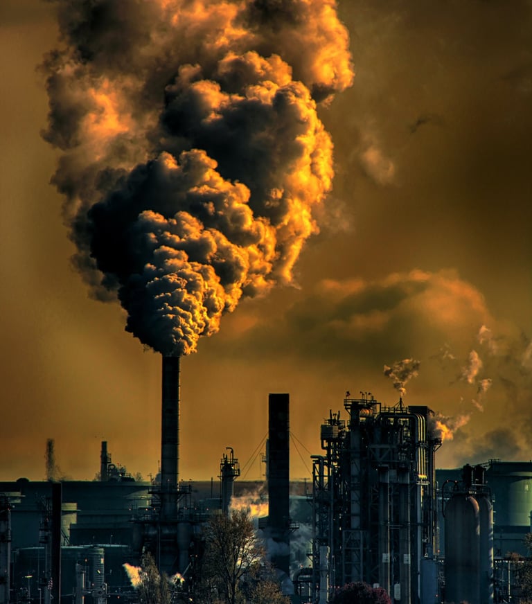 a large amount of smoke billowing out of a fossil fuel factory