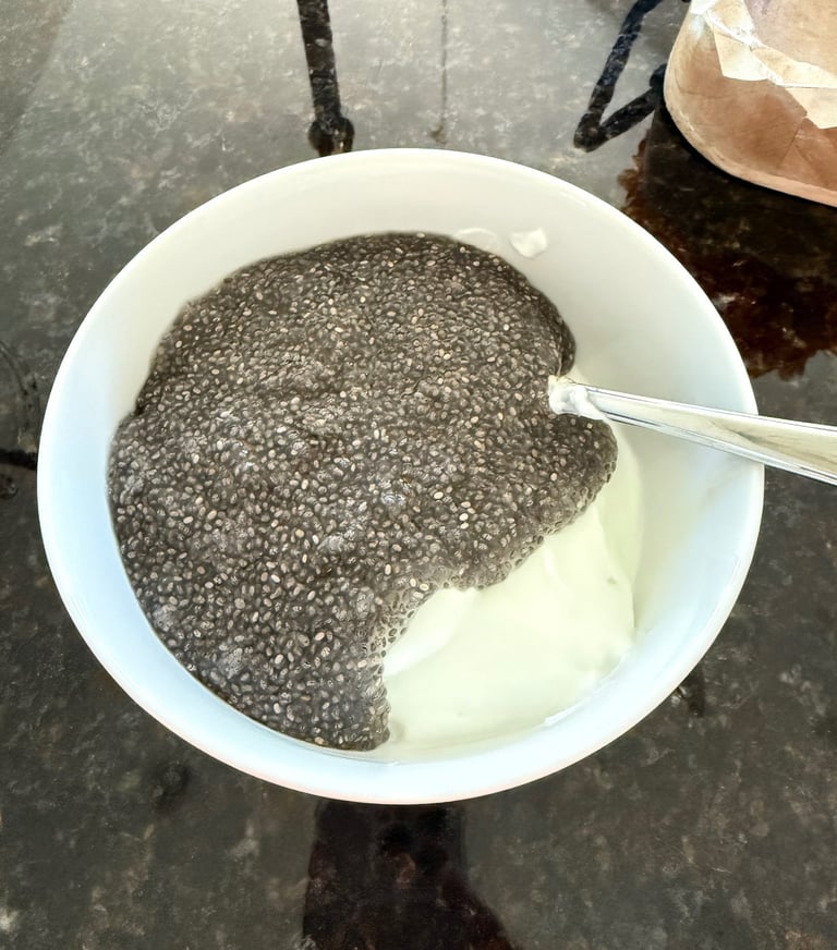 Soaked chia seeds mixed into Greek yogurt before adding toppings.