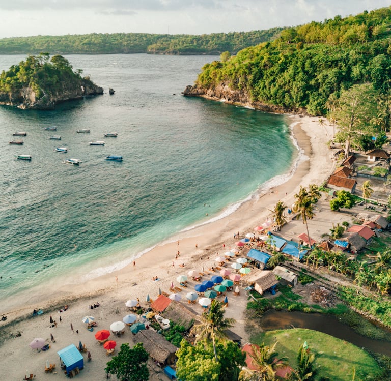 Aerial view of Crystal Bay beach in Nusa Penida Bali with white sand and turquoise water.