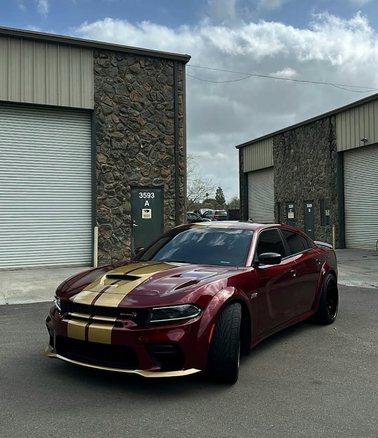 Custom matte metallic burgundy Dodge Charger with gold racing stripe and accents in Livermore, CA.