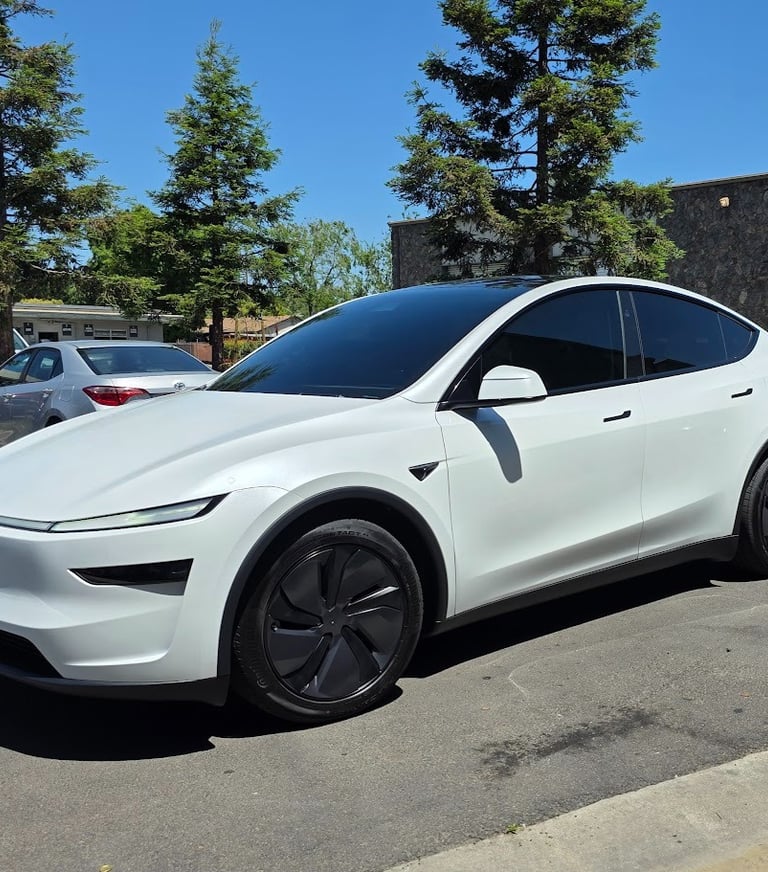 Ceramic window tint installation on a white tesla in Livermore