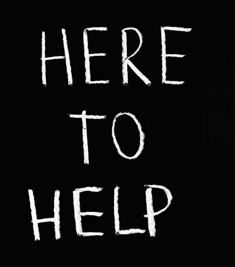 📝 "Here to Help" handwritten on blackboard-style background