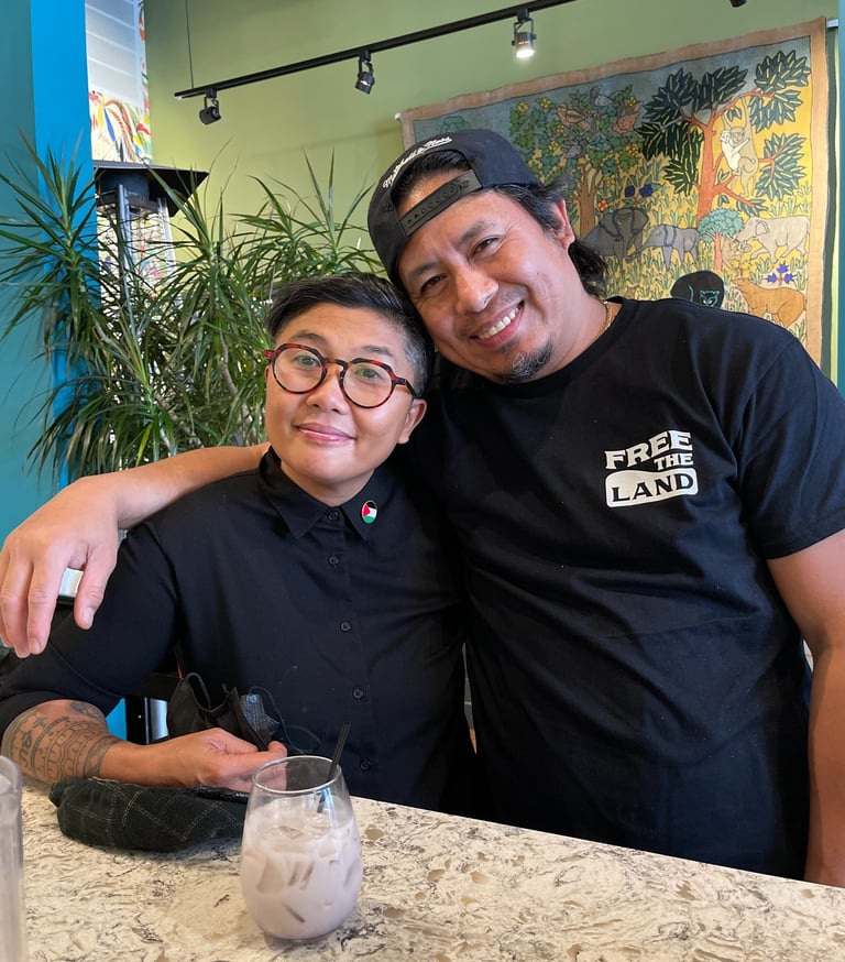 two understory collective participants standing in front of a table