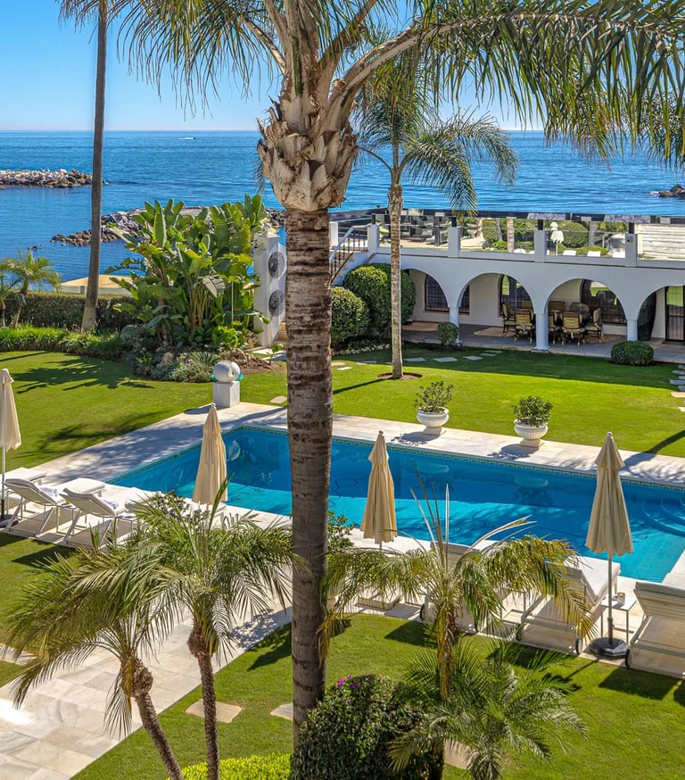 Garden and pool area in beachfront villa Marbella with direct sea views