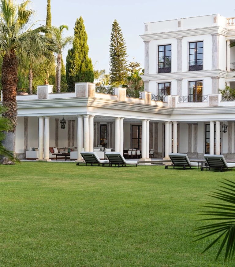 Villa exterior surrounded by lush gardens