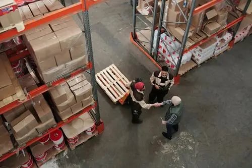 Warehouse operations with workers managing inventory and logistics for supply chain support