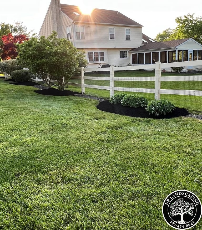 excellent landscaping and hardscaping of grass, stones and trees by NP Landscaping