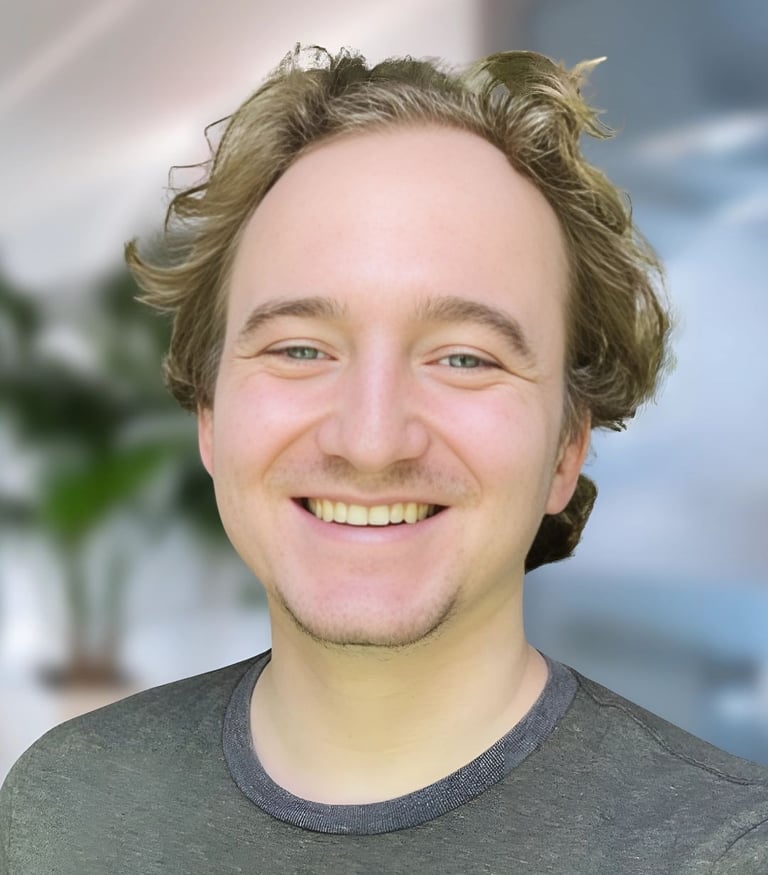 a man with a beard and a beard smiling