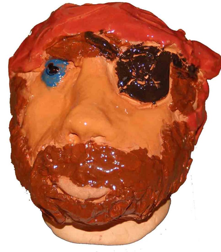 clay head of a blue eyed pirate