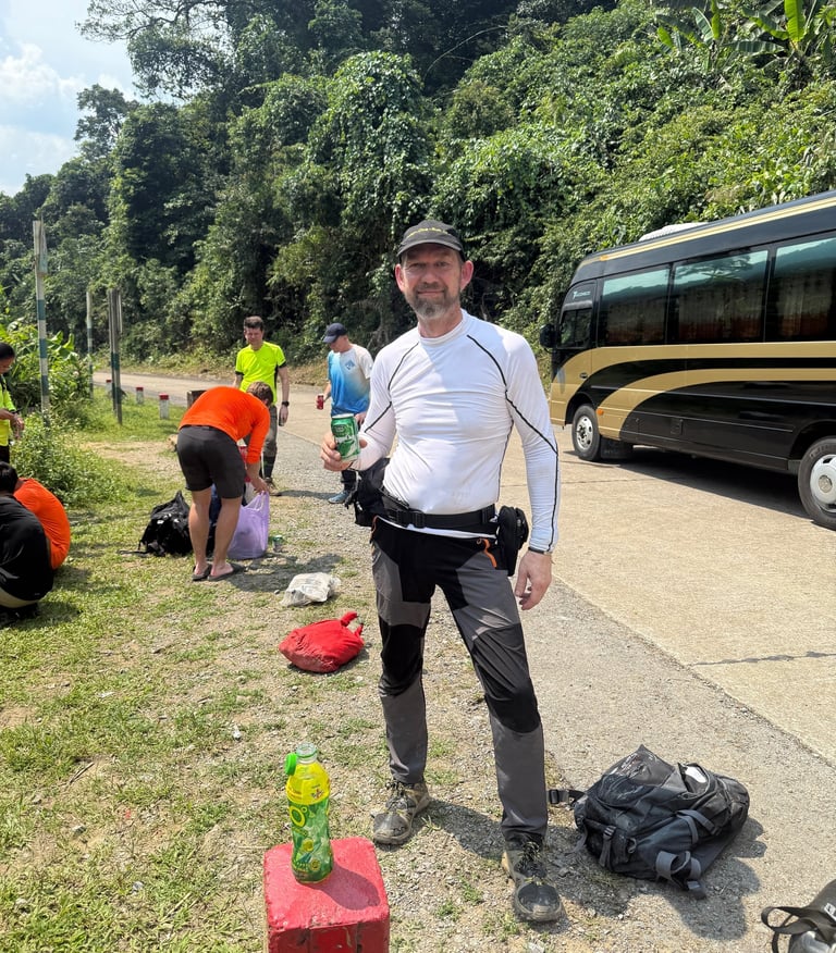 Nick Billington enjoying a cold beer after completing the Hang Son Doong Cave expedition in Vietnam
