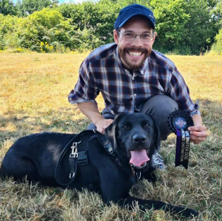 Geoff Bunce and his Dog Raven getting a distinction for UK Sniffer Dog testing