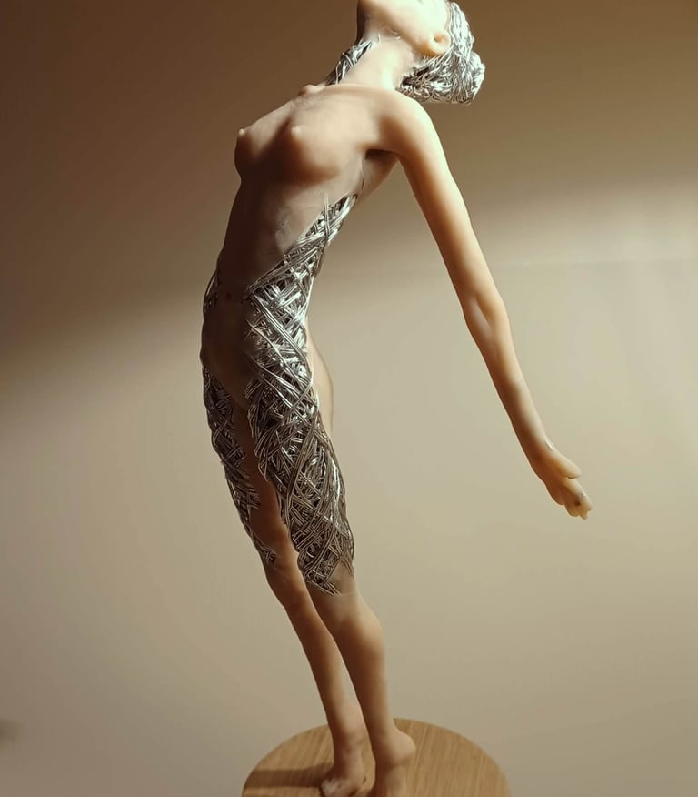 A detailed polymer clay and wire sculpture of a standing female figure, stretching with arms back