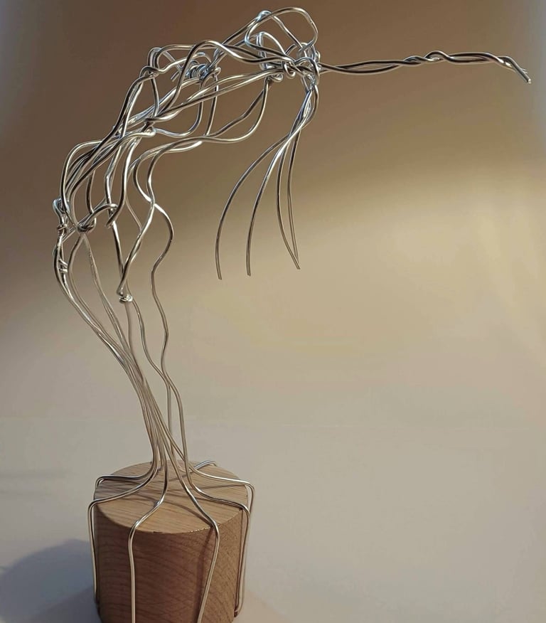 A wire sculpture of a complete female figure, standing, bending over backwards, arms out