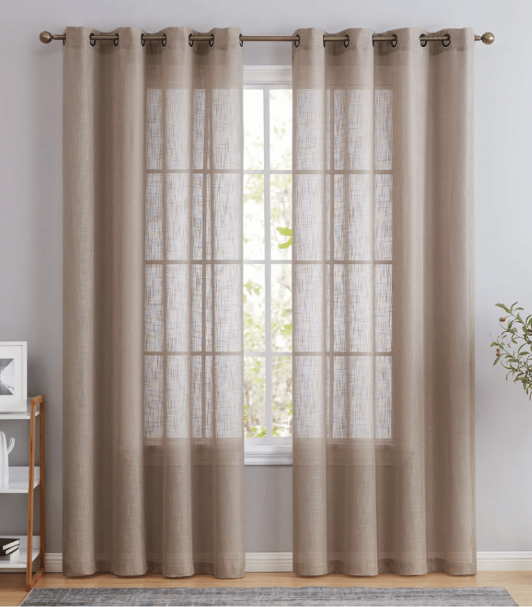 Elegant taupe linen sheer curtains with grommet top hanging on a window for soft natural light.
