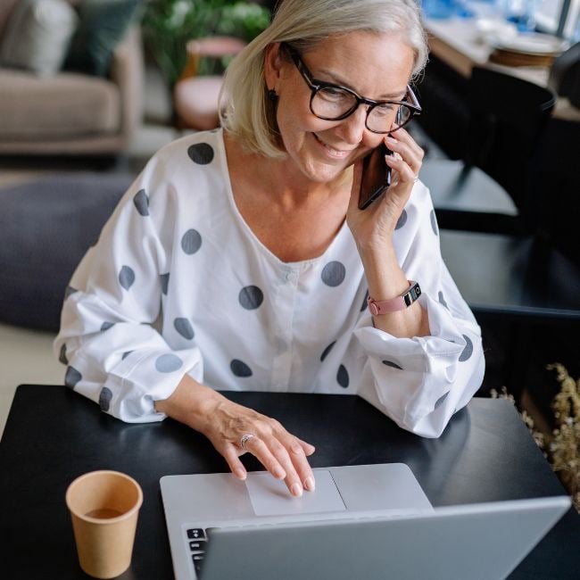 smiling woman on laptop