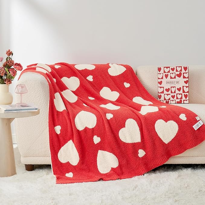 Plush red heart-patterned throw blanket made from ultra-soft microfiber. Ideal for valentines day