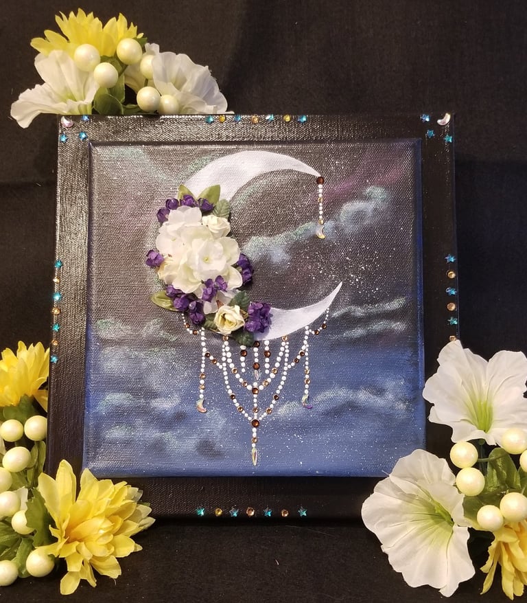 a painting of a crescent moon with flowers and crystals.