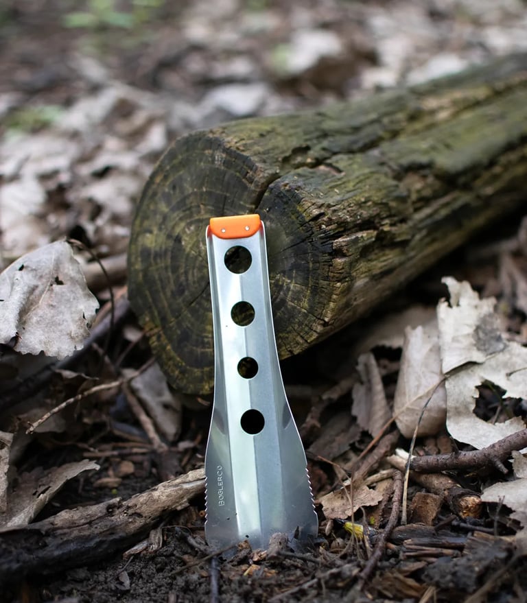 boglerco trowel stuck on ground by log