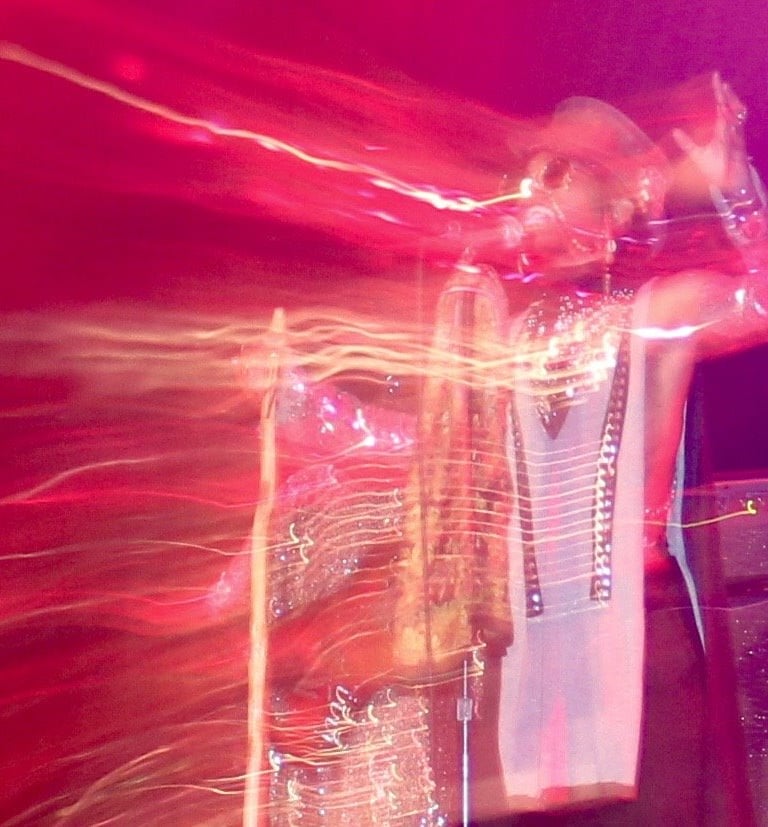 Live concert performance with visual effects on singer