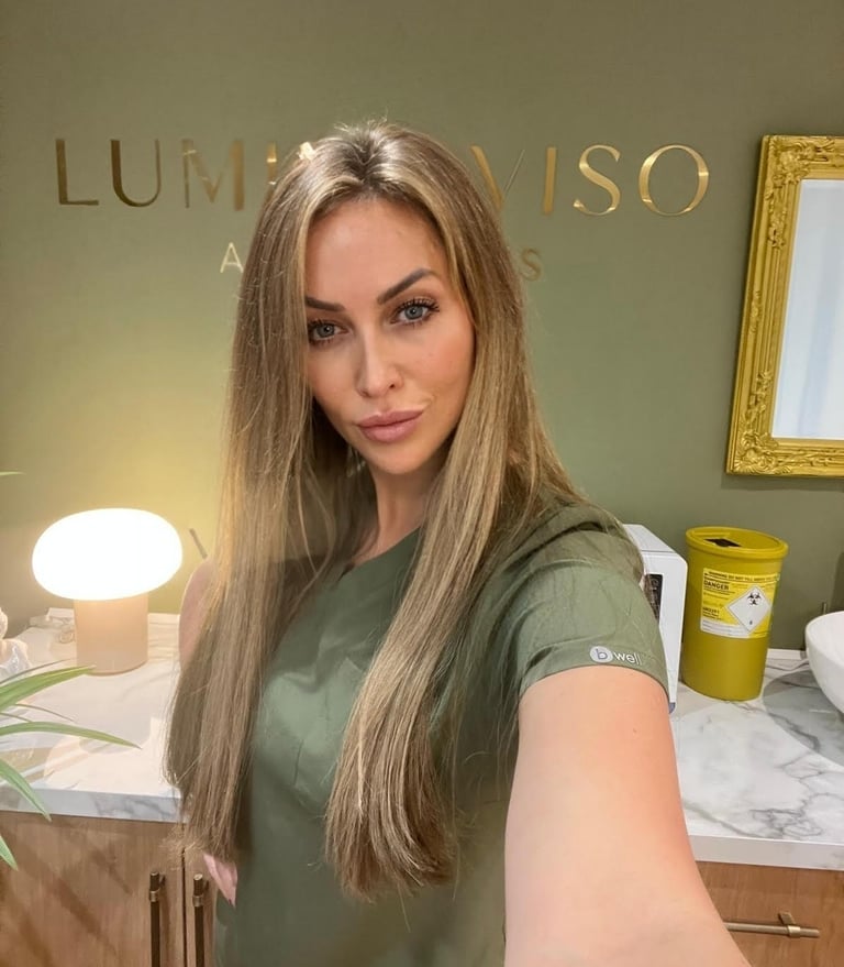 a woman in a green dress standing in LuminaViso Wokingham