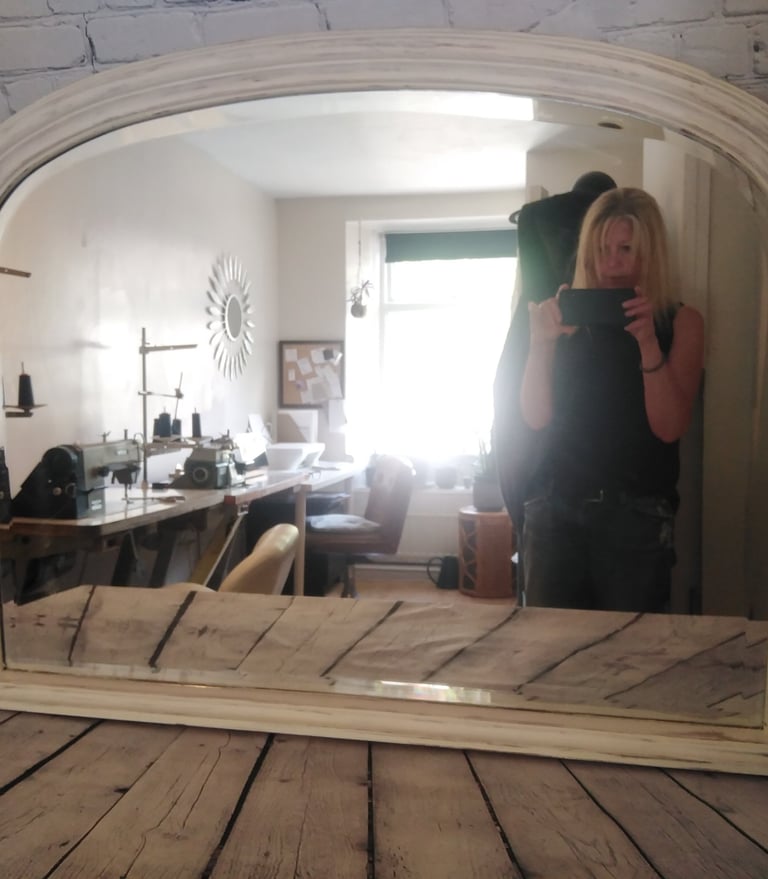 Lynn the owner of Hut photographing a vintage mirror is the studio