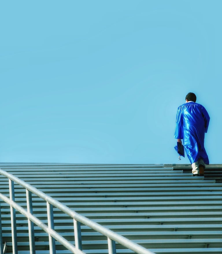 a man in a blue suit walking up stairs
