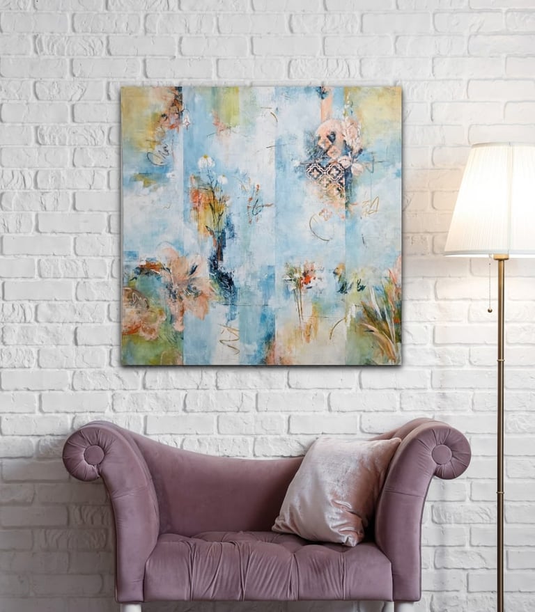 Modern abstract canvas wall art in blue and gold hanging above a purple velvet chaise lounge.