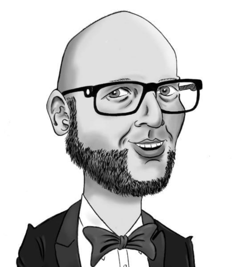a man in a tuxedo suit and bow tie
