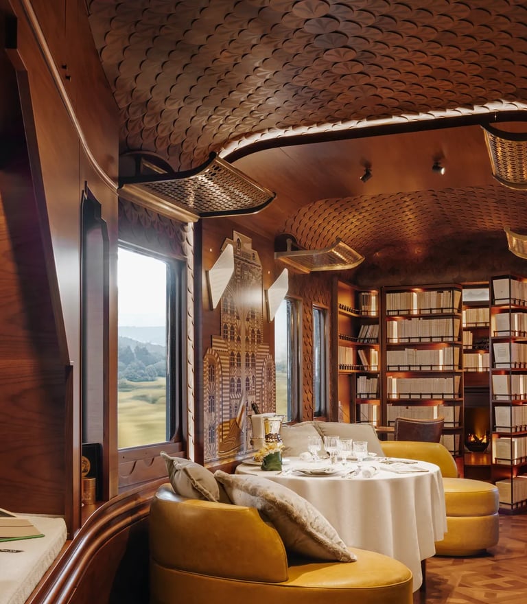 Britannic Explorer train L’Observatoire lounge with marquetry design and private dining area.