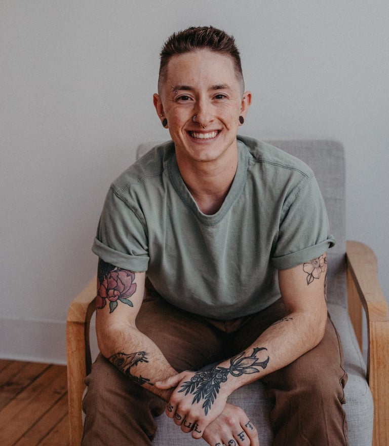 a person sitting in a chair and smiling