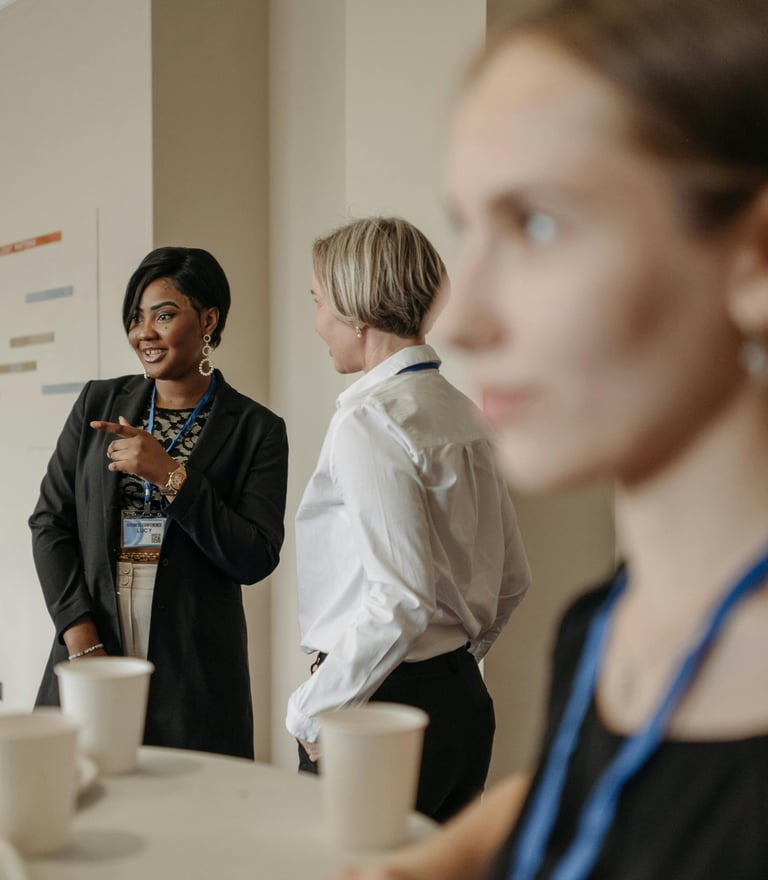 Justice support staff coordinating work and priorities in a busy room 