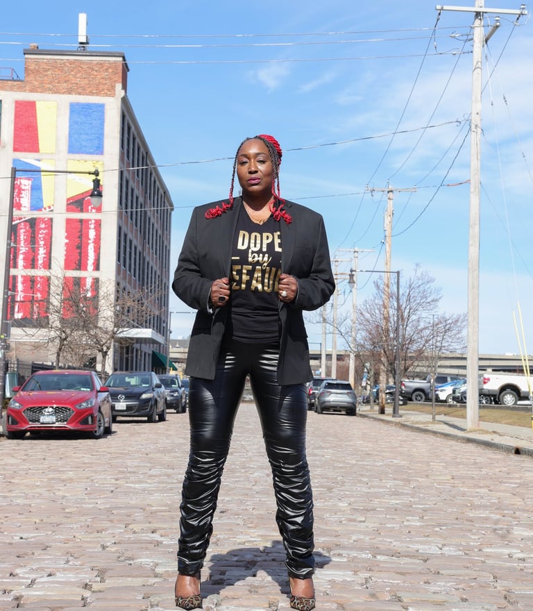 Genia Myers Collins posing confidently in Buffalo NY