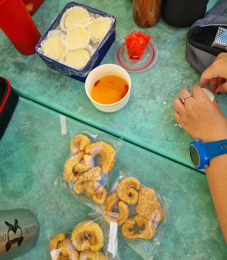 Carcar chicharon with cheesecake for snacks after scuba diving