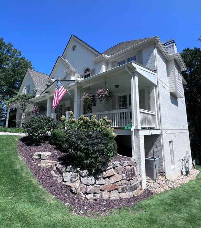 Professional seamless aluminum gutter installation.