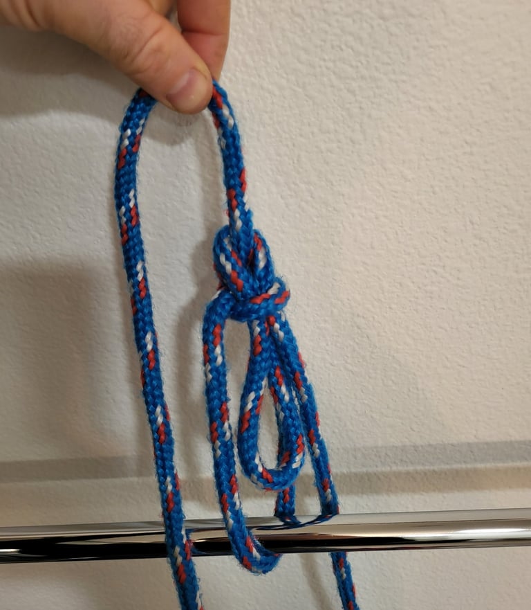 Bowline with a bight tied in the middle of a blue rope