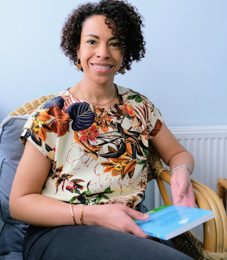 Miriam Lewis seated in therapy room
