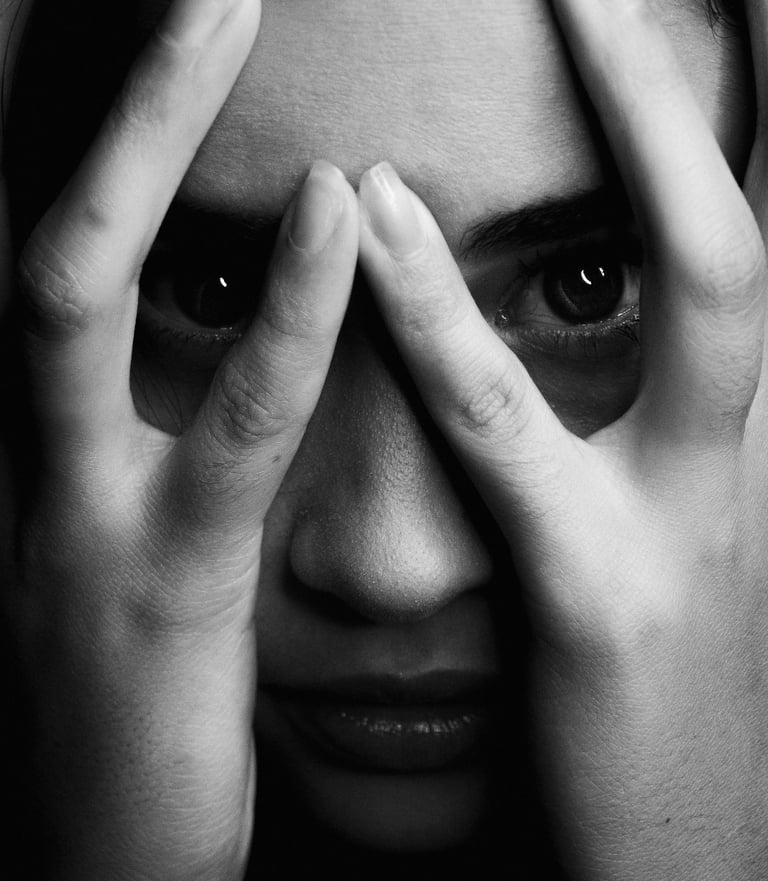 a woman with her hands on her face and hands on her face