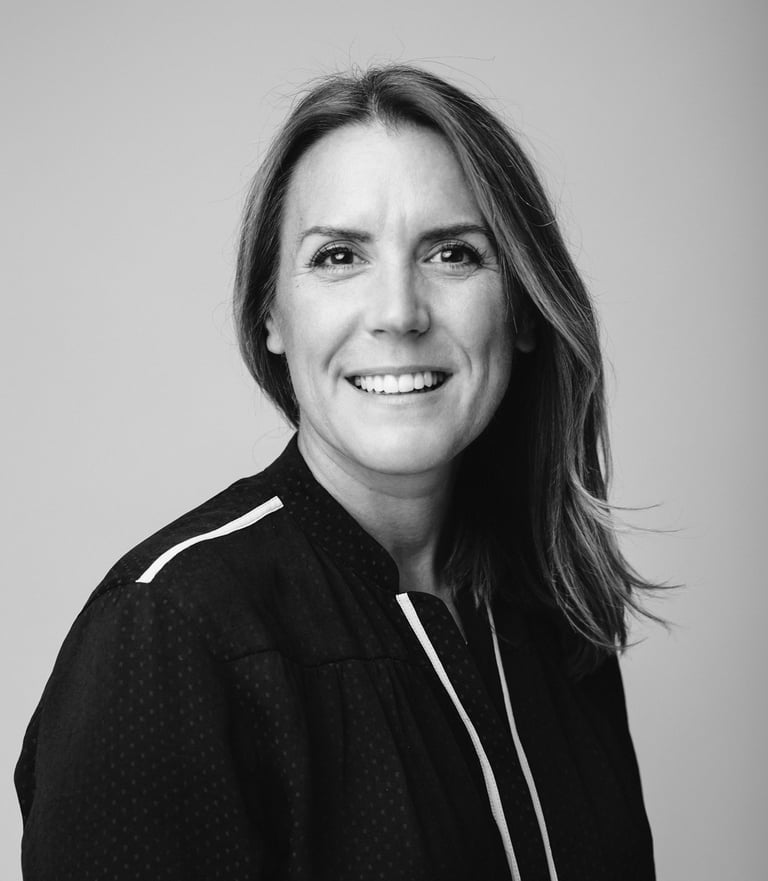 Black and white headshot of a white, middle aged women who is a counsellor