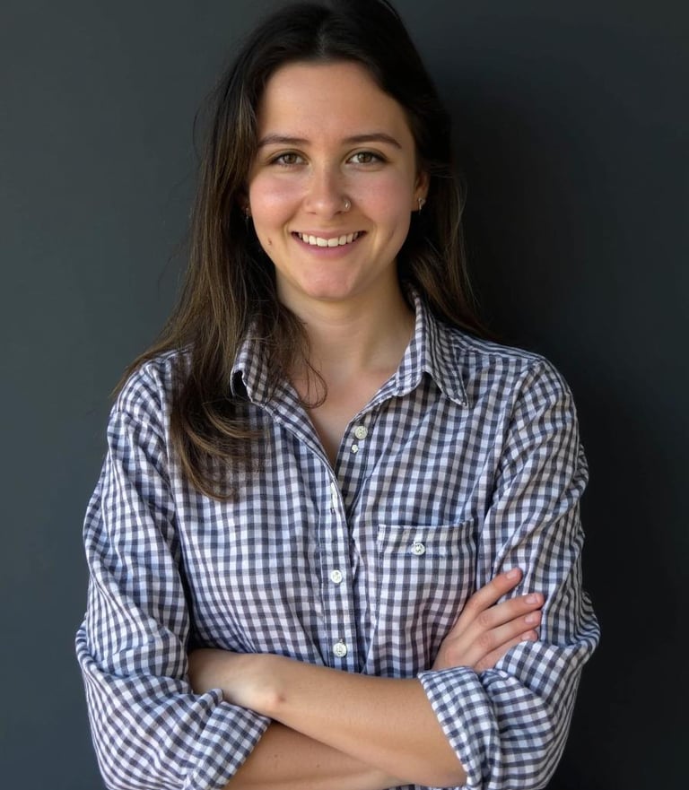a woman in a checkered shirt and jeans