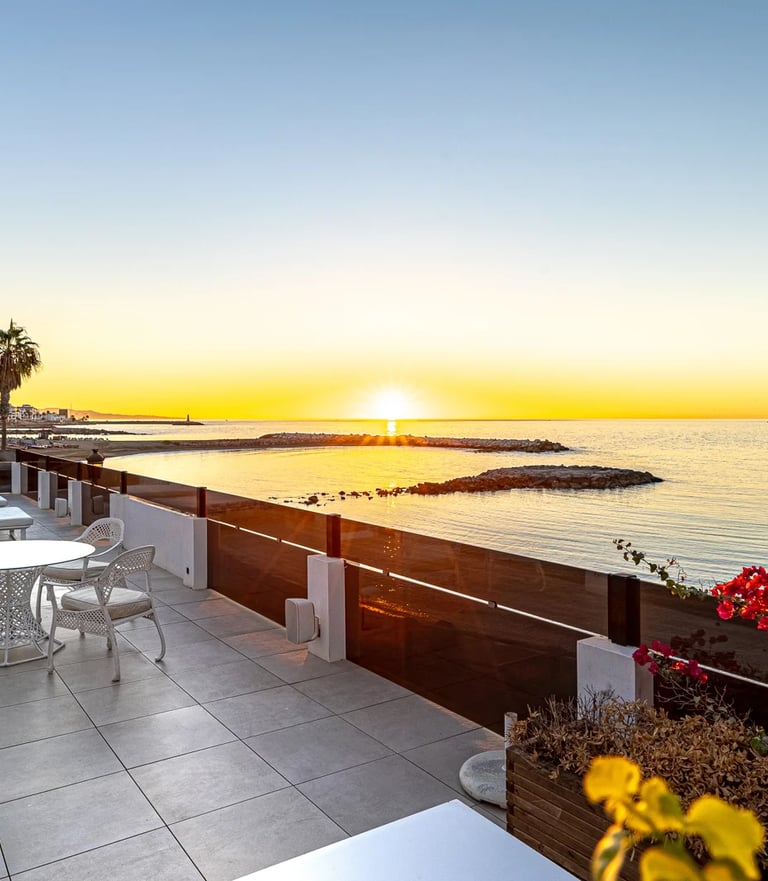 Sunset terrace overlooking the sea in beachfront villa Marbella near Puerto Banus