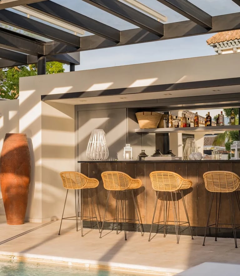 Outdoor bar and lounge area by the pool at Villa El Olivo, Marbella