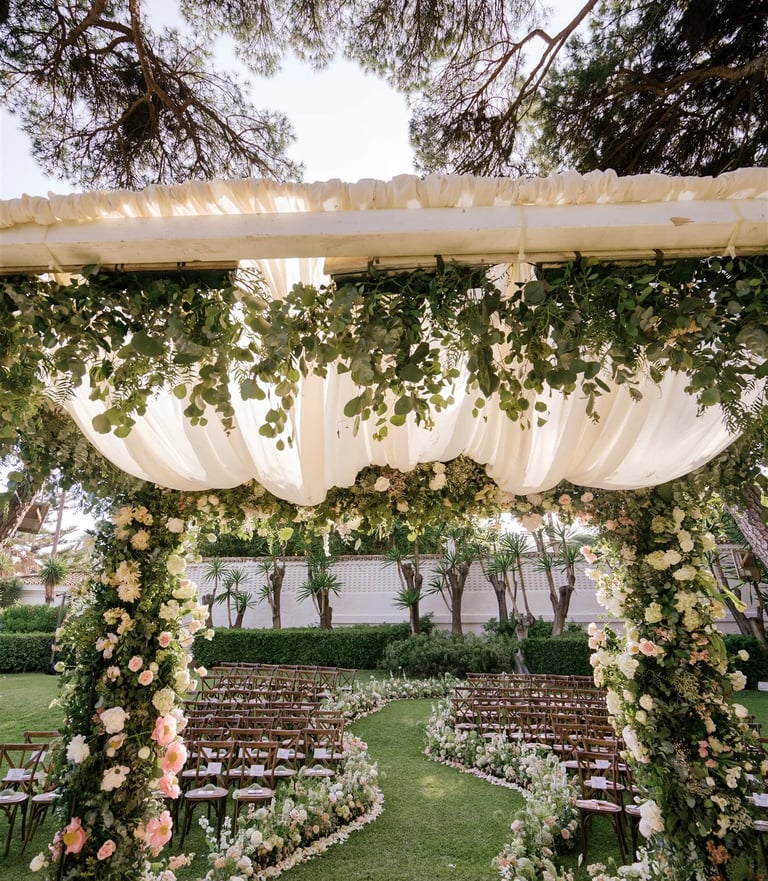 Floral wedding canopy with garden ceremony seating