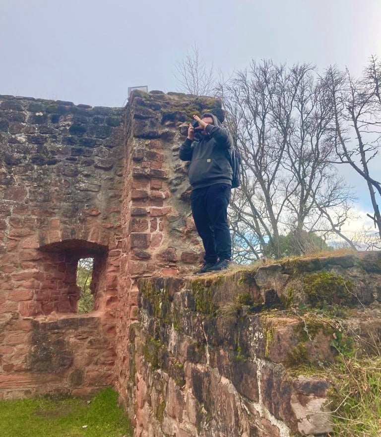 a man taking a picture of a woman taking a picture of herself