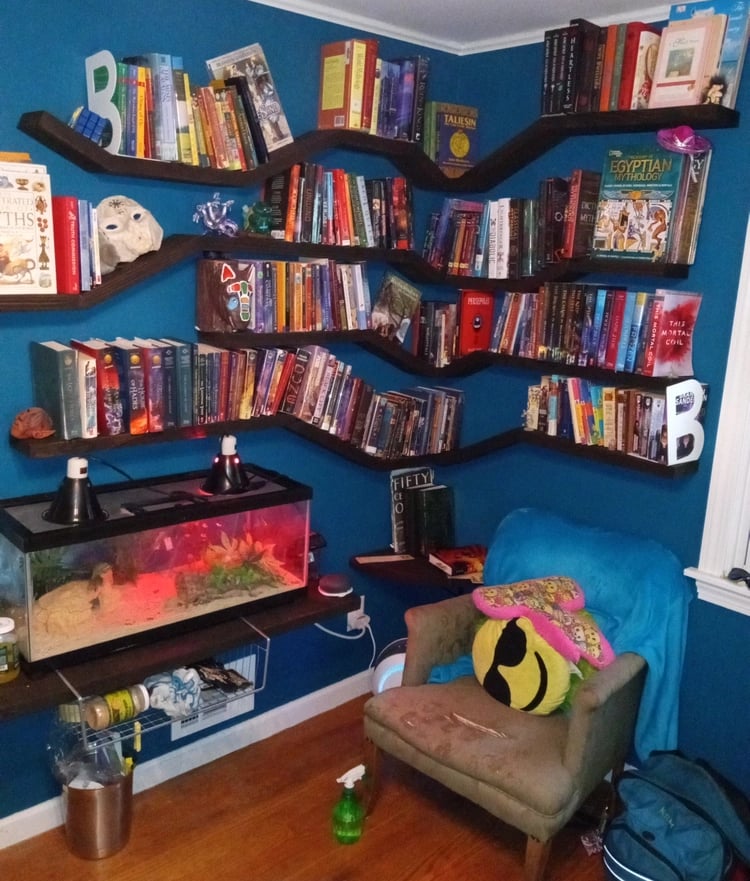 Floating shelves unit with multiple angles, filled with books