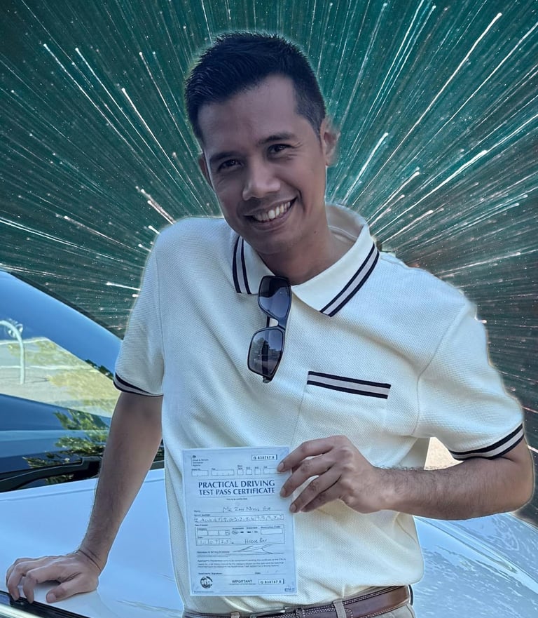 Man holding a certificate of passing a practical driving test in the UK