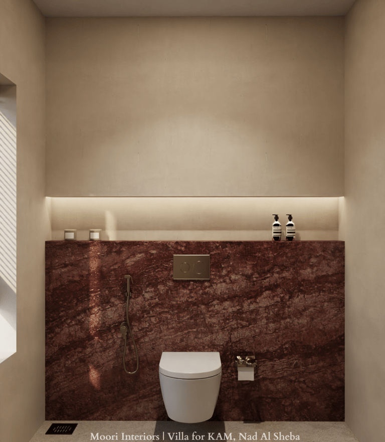 Modern bathroom featuring Emperador marble walls and a white toilet.