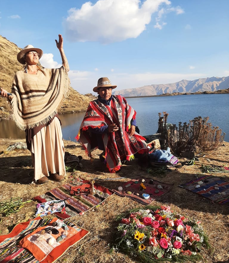 a medicine woman and a medicine man in a Despacho ceremony praying with the spirits of the mountain