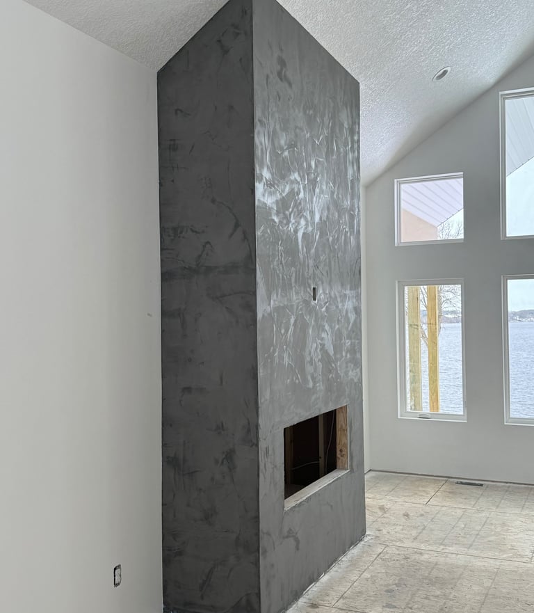 custom home with textured ceilings and custom fire place