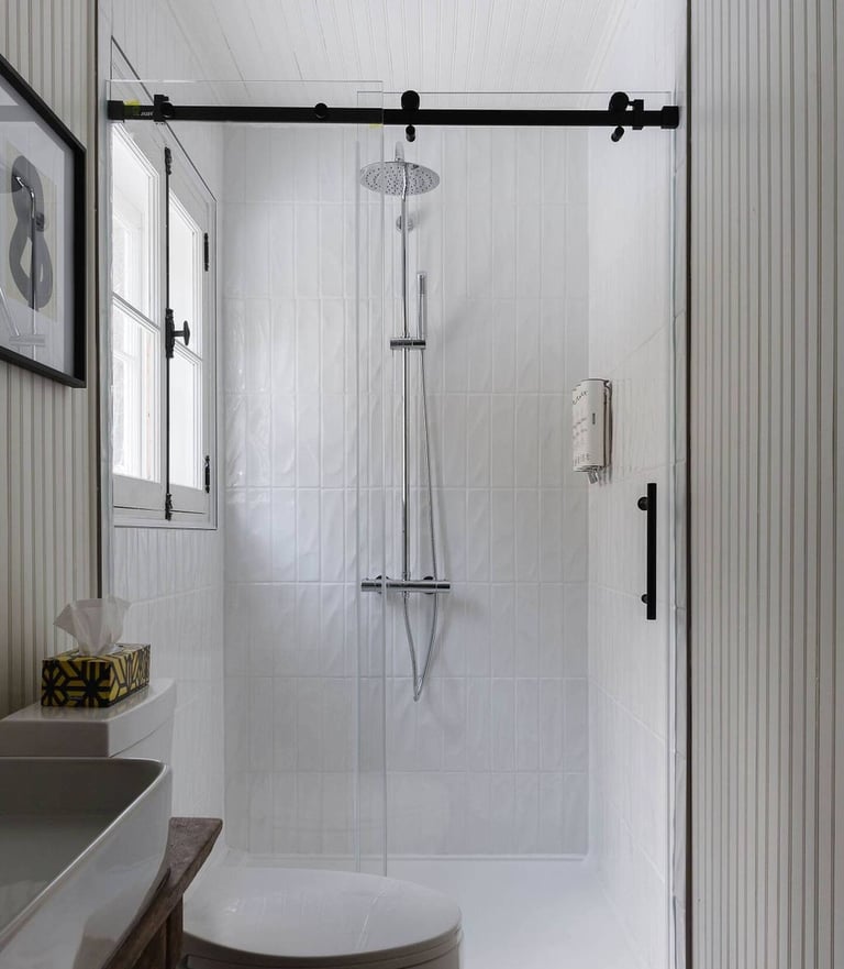 a bathroom with a toilet and a shower
